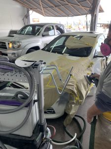 Cars being worked on in a garage